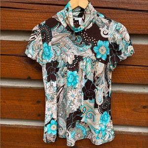 Women’s top. Size small. Brown, cream, blue in color. Stretch fabric. Like new.